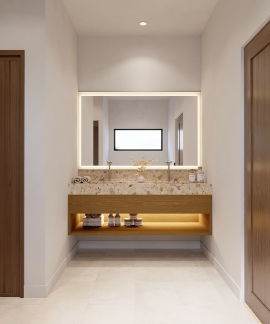 Bath with terrazzo counter and backlit mirror